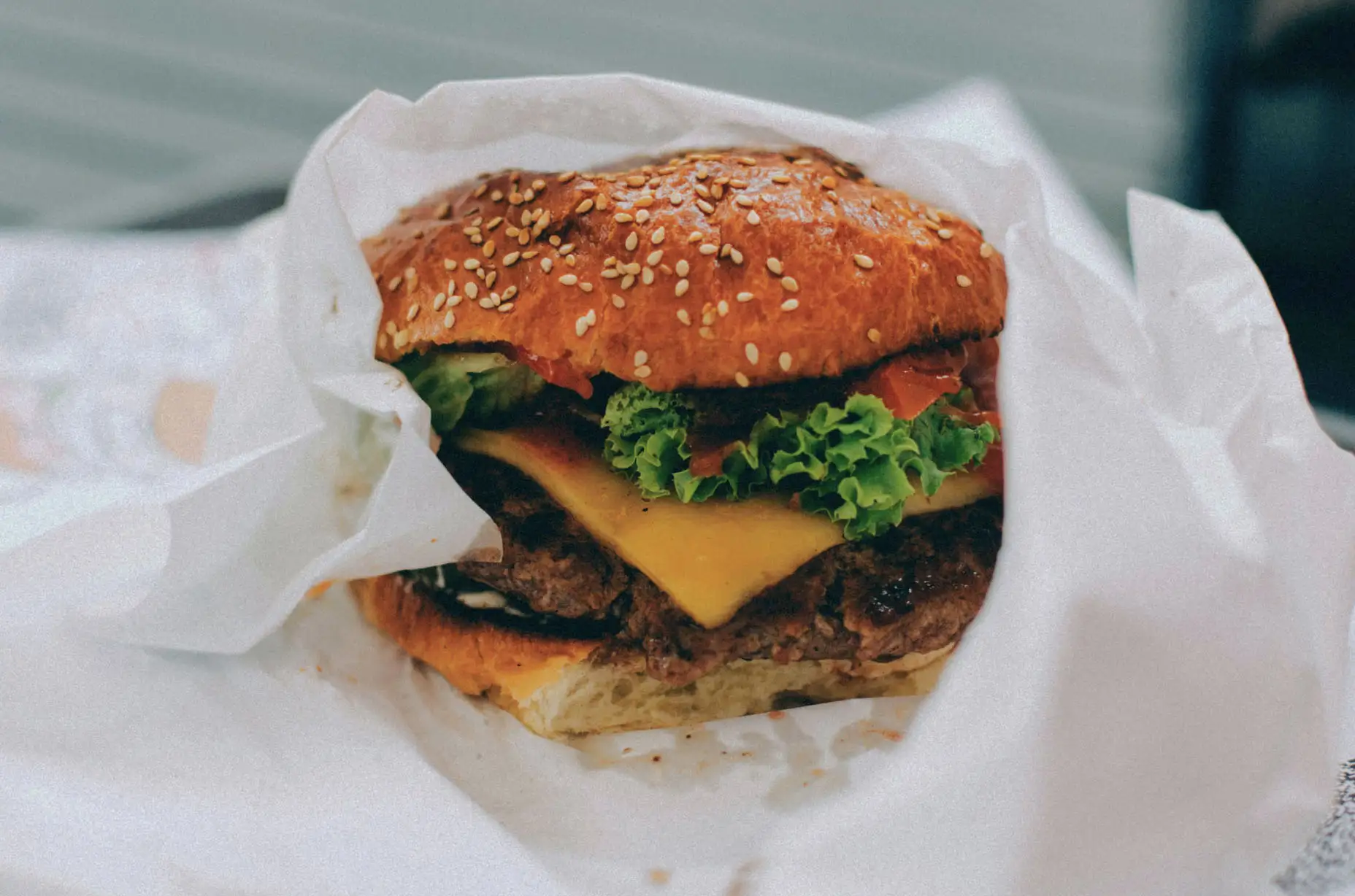 A burger wrapped on paper